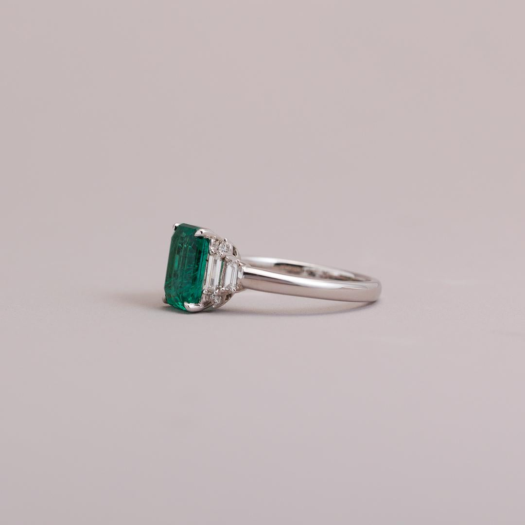 Emerald cut Emerald and diamond art deco engagement ring in white gold