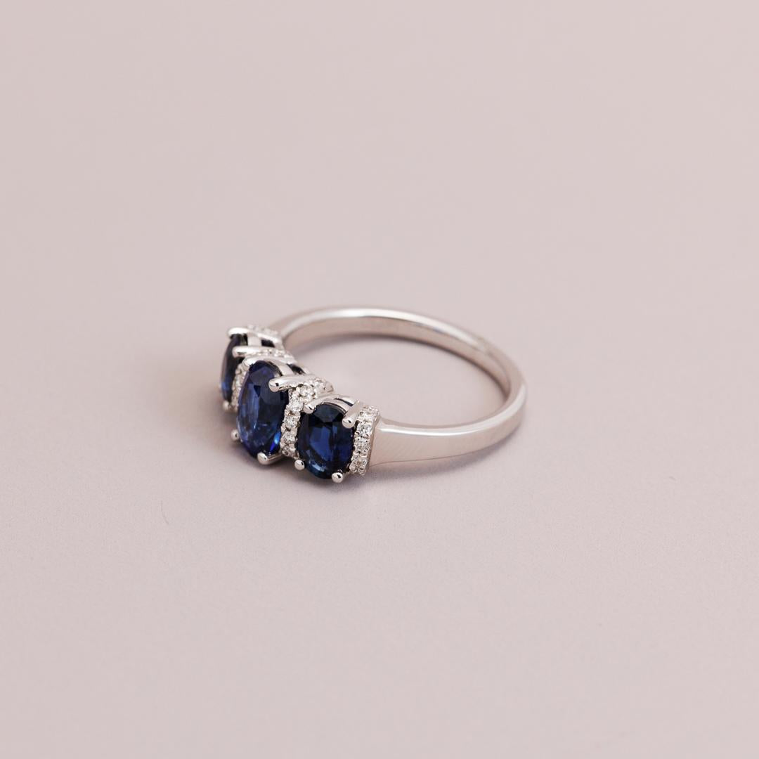 Oval Sapphire and diamond three-stone engagement ring