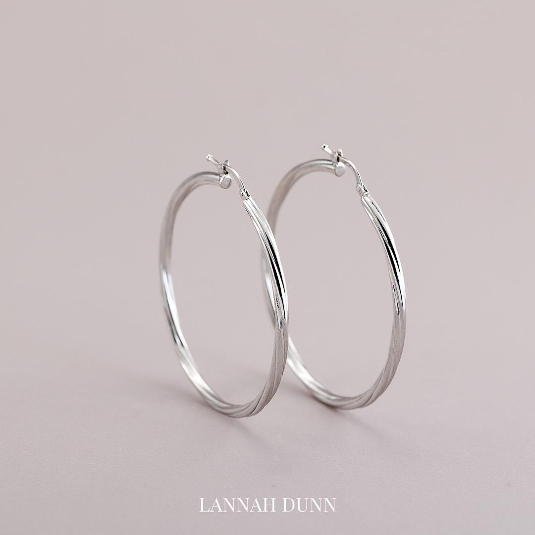 Large white gold twist hoop earrings