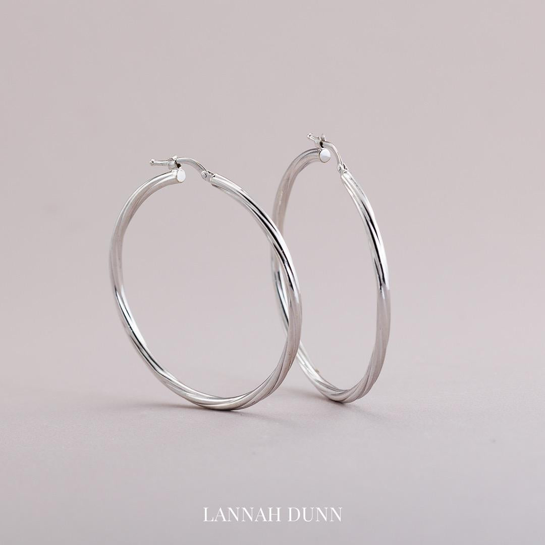 Large white gold twist hoop earrings