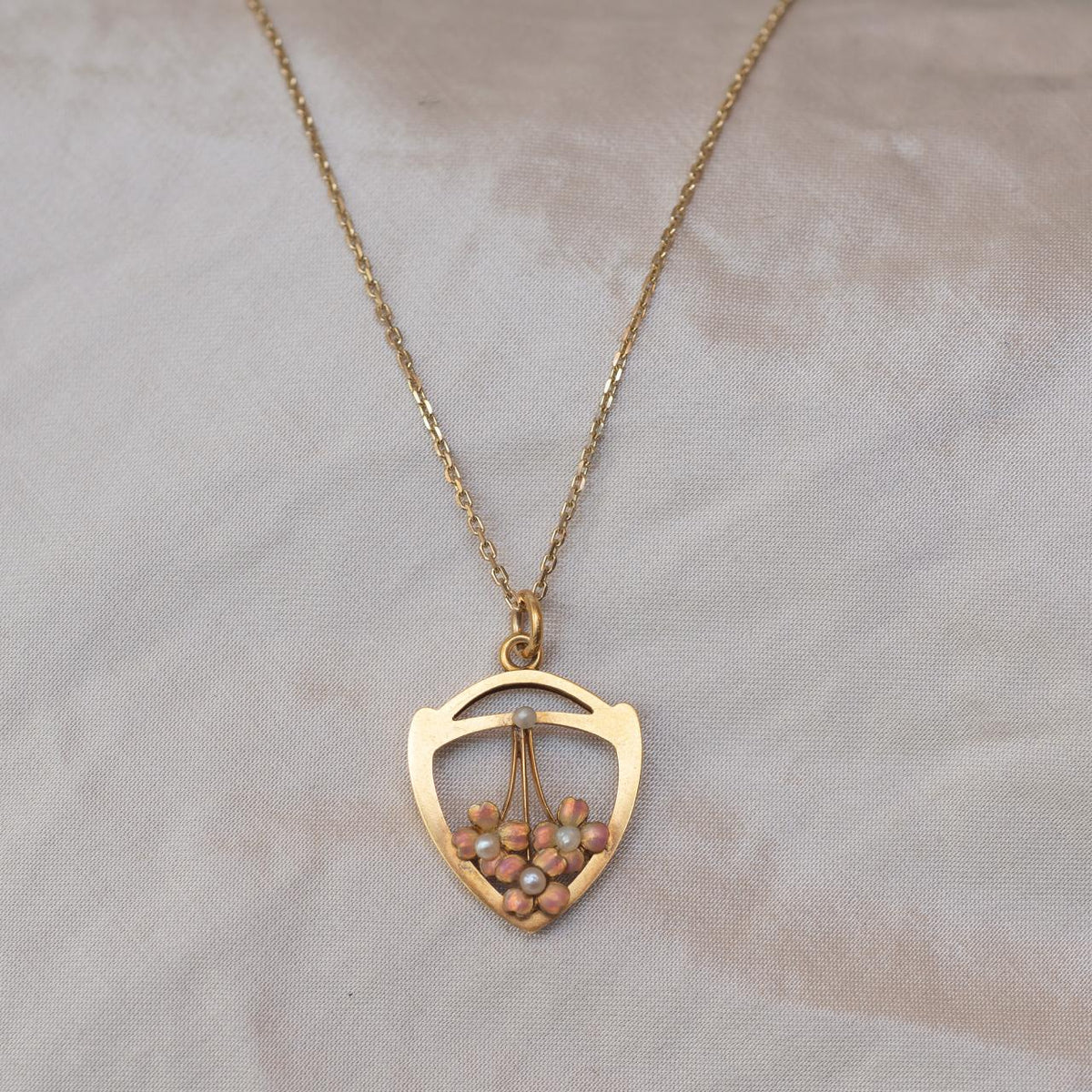 High-carat, charming enamel & pearl pendant