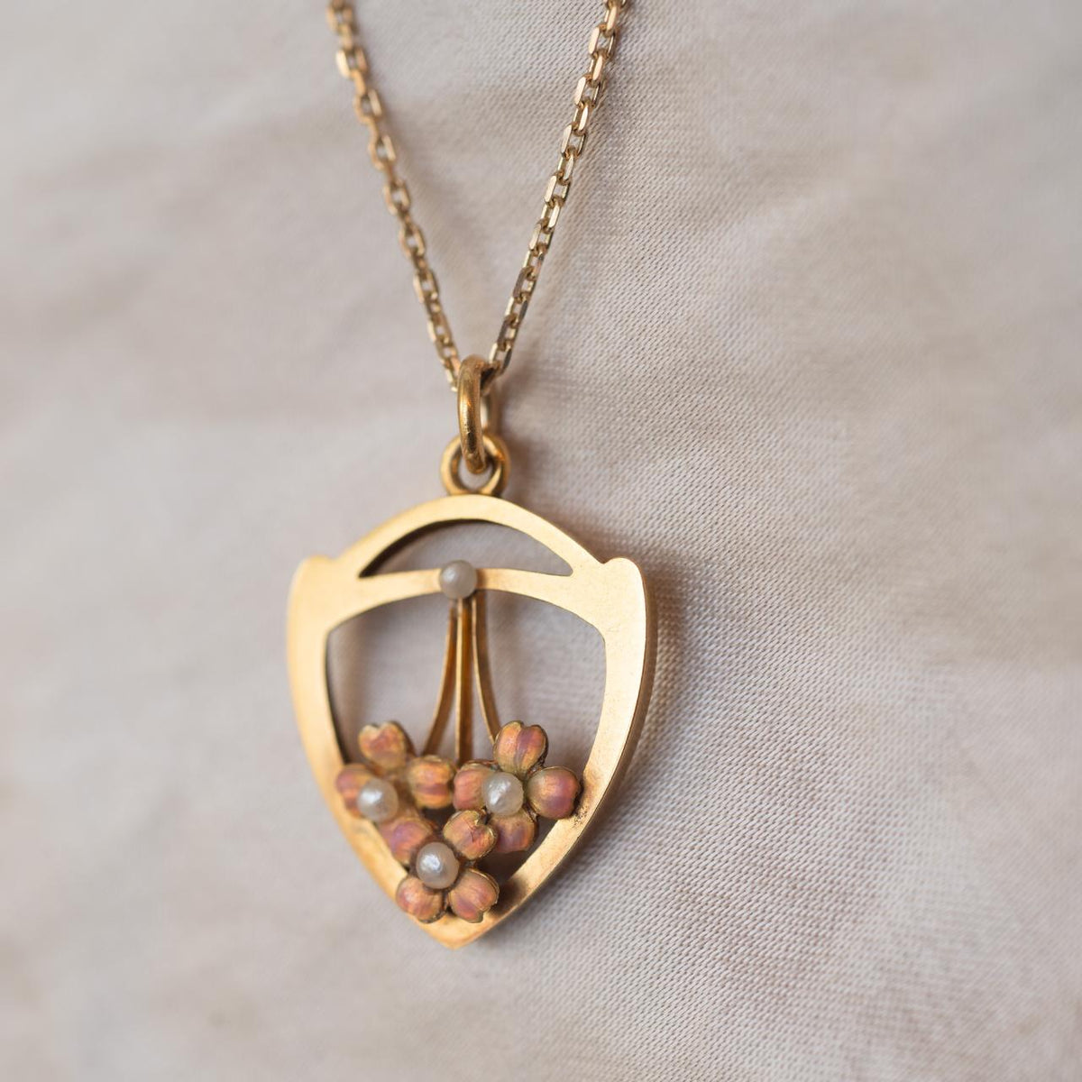 High-carat, charming enamel & pearl pendant