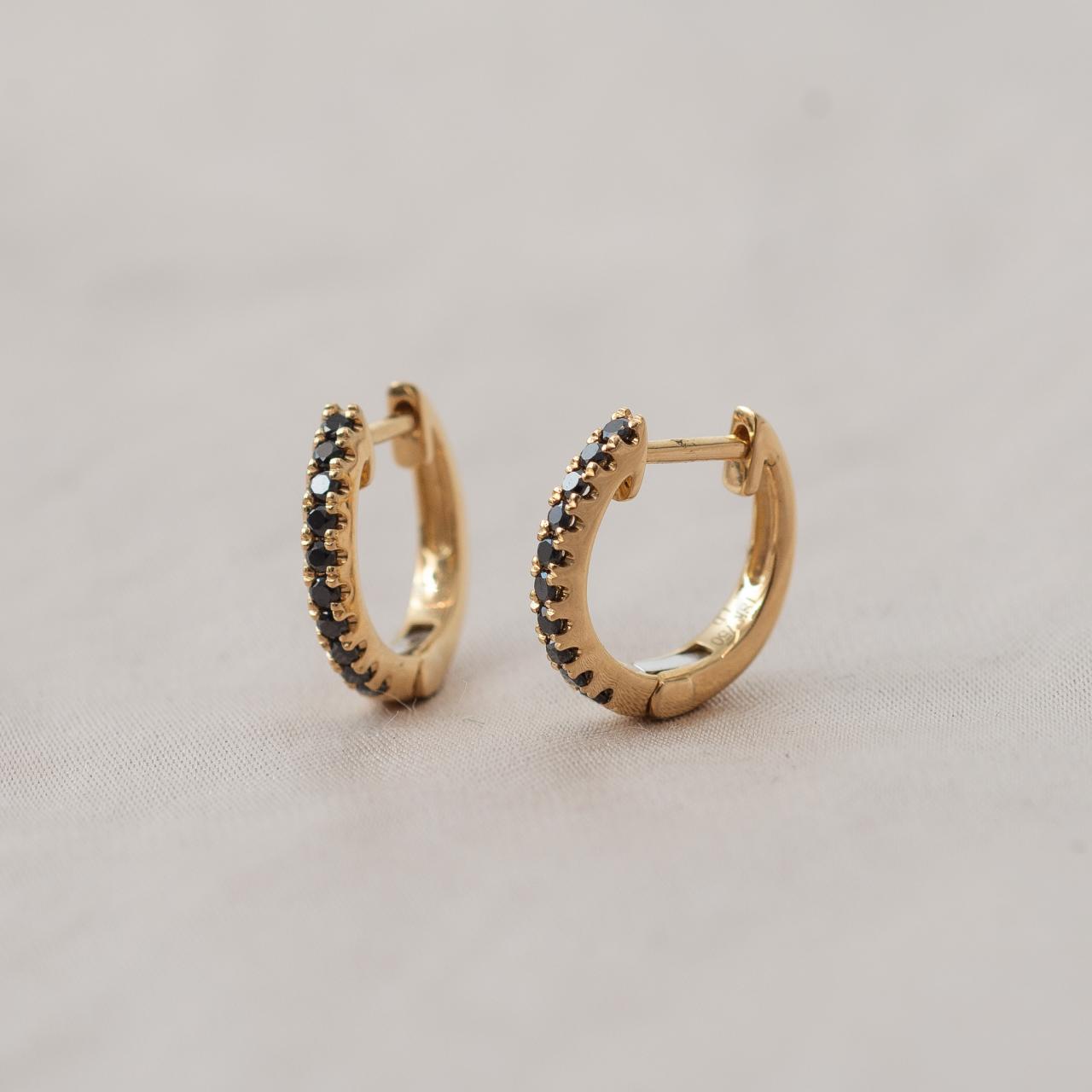 Dainty black diamond huggies, yellow gold