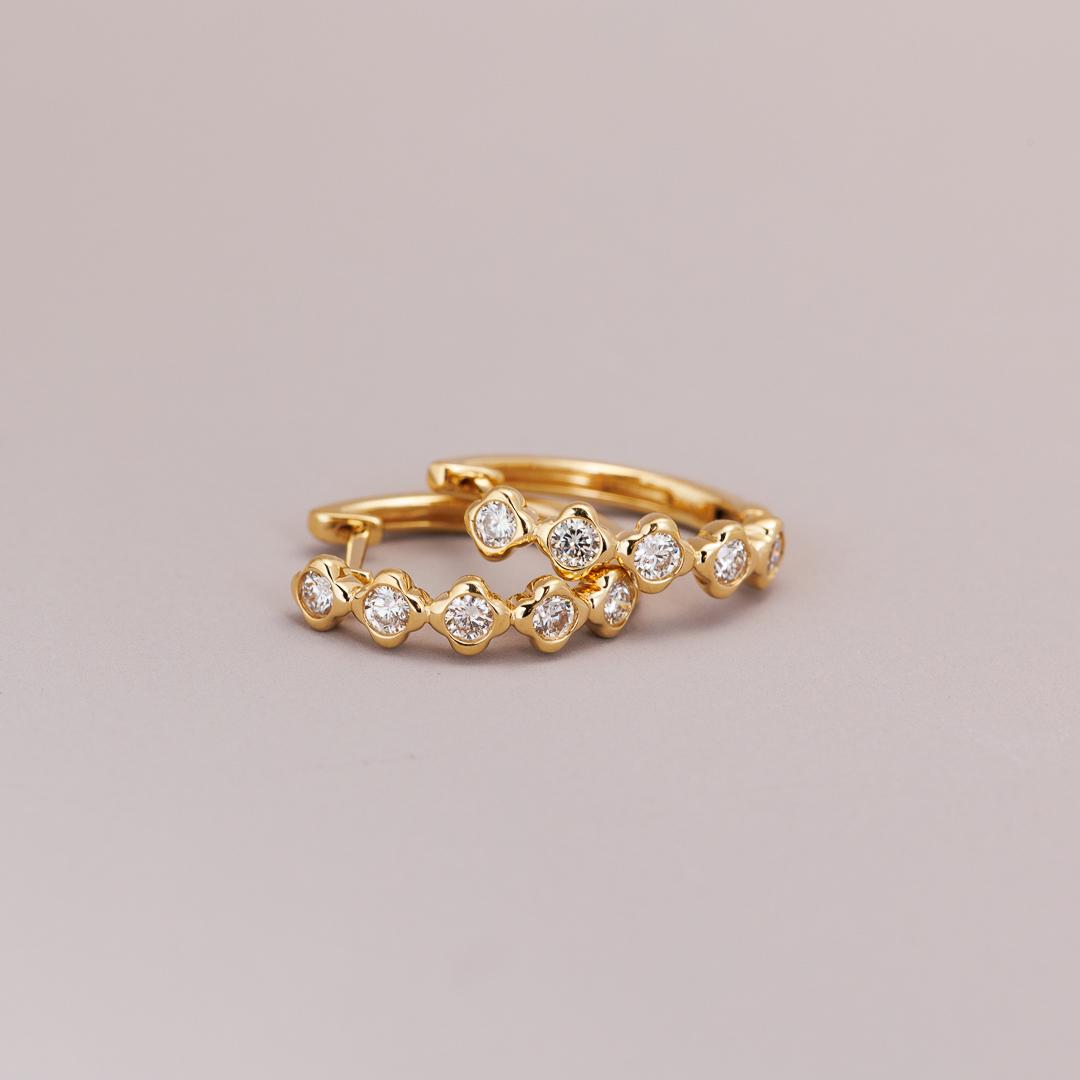 Yellow gold diamond clover huggie earrings