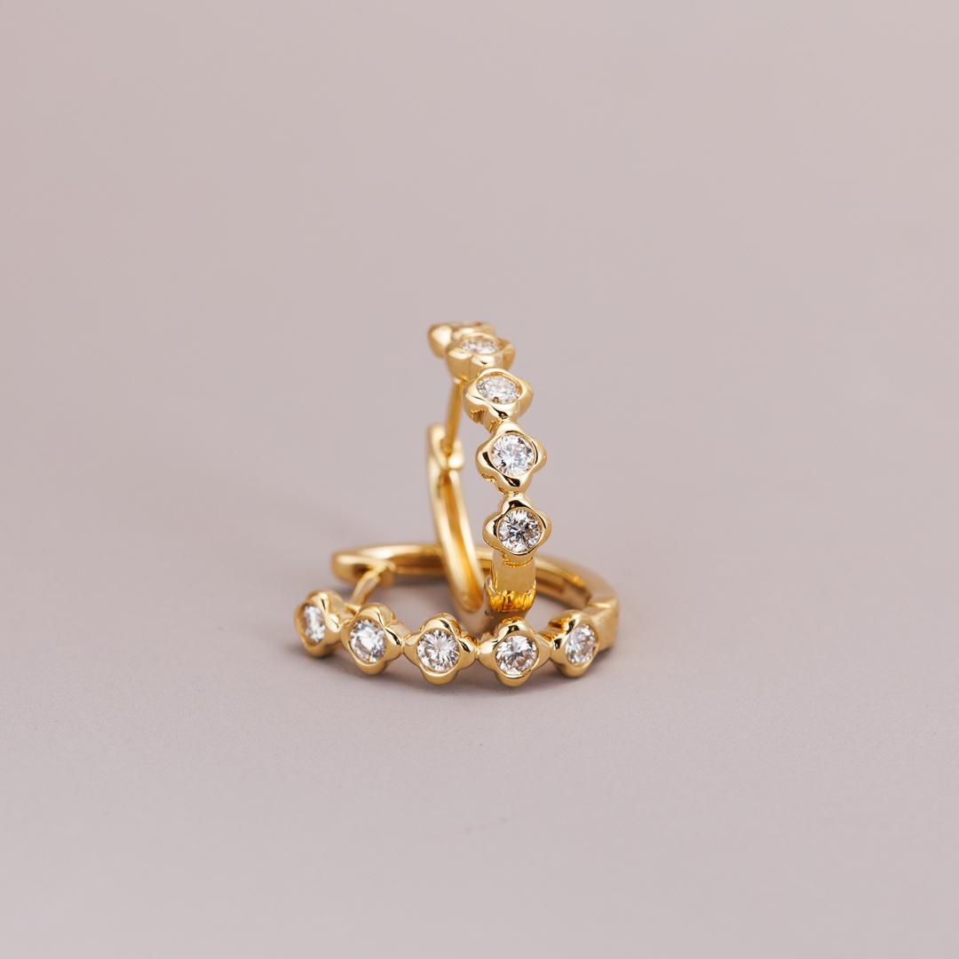 Yellow gold diamond clover huggie earrings