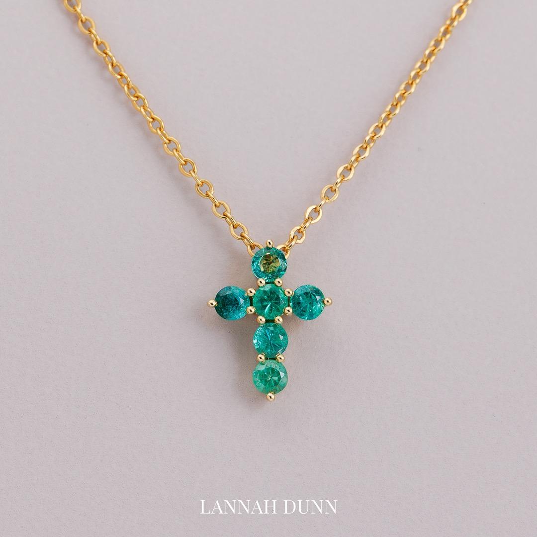 Emerald gem set cross pendant