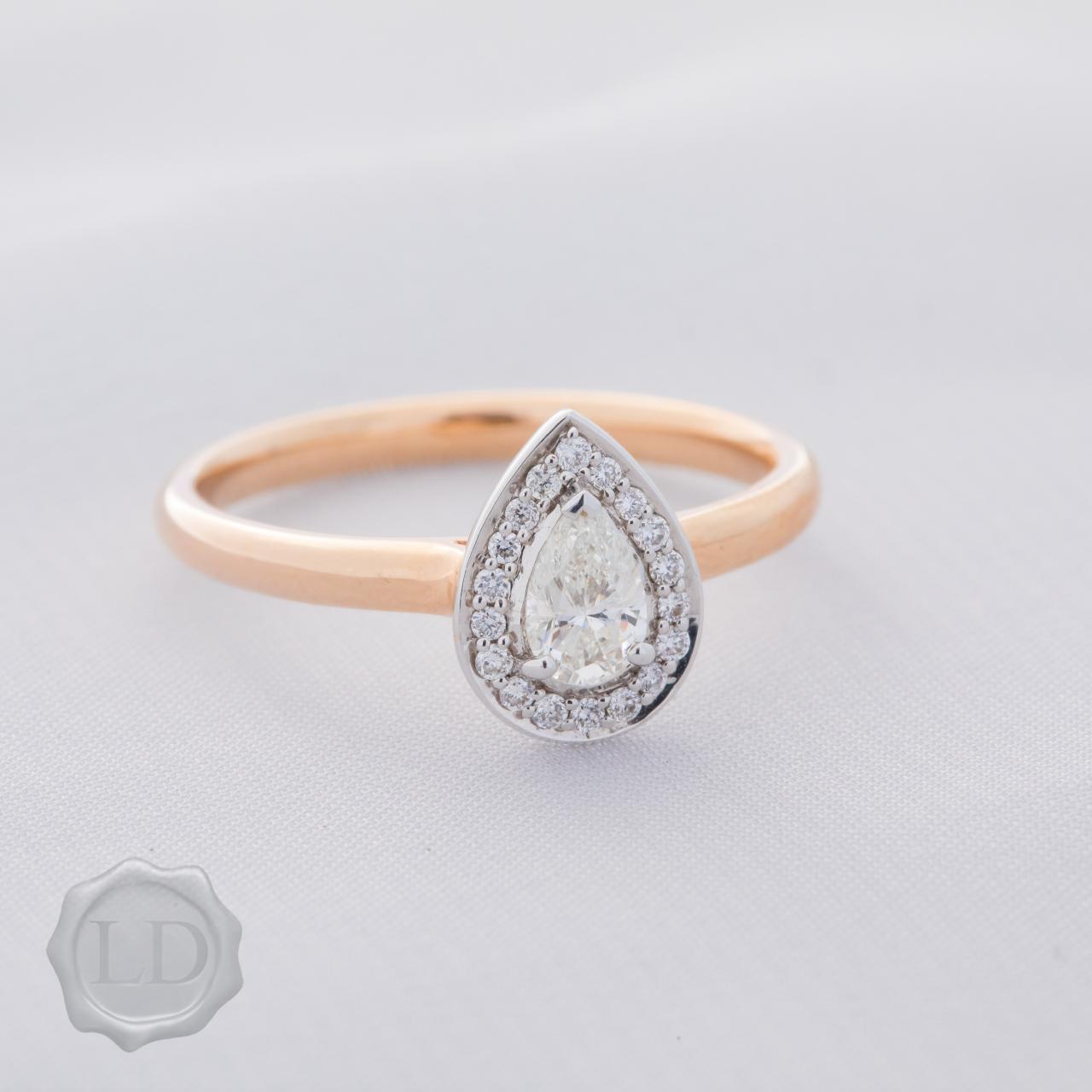 Pear cut halo engagement ring in 18ct rose & white gold