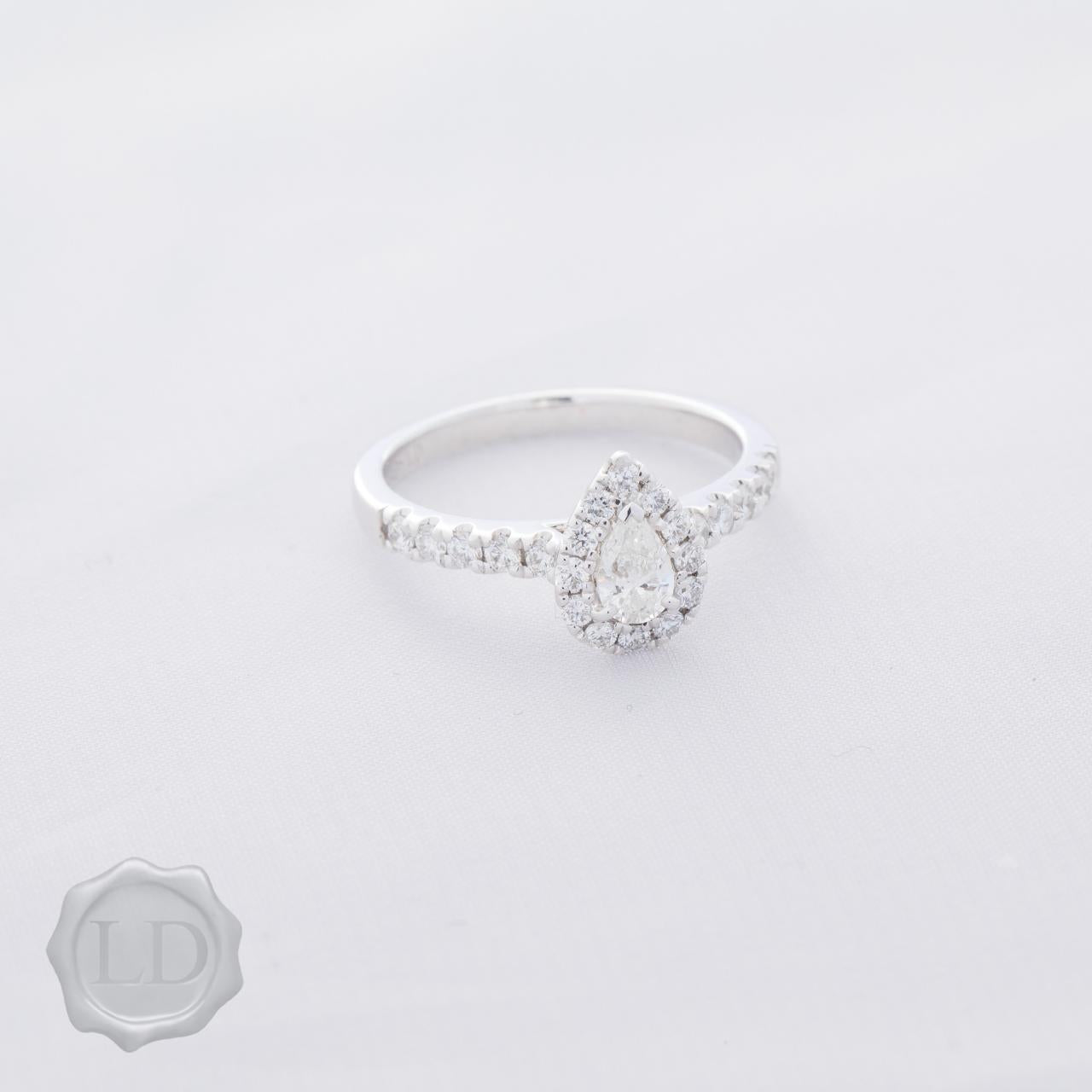 Pear-cut halo with diamond band