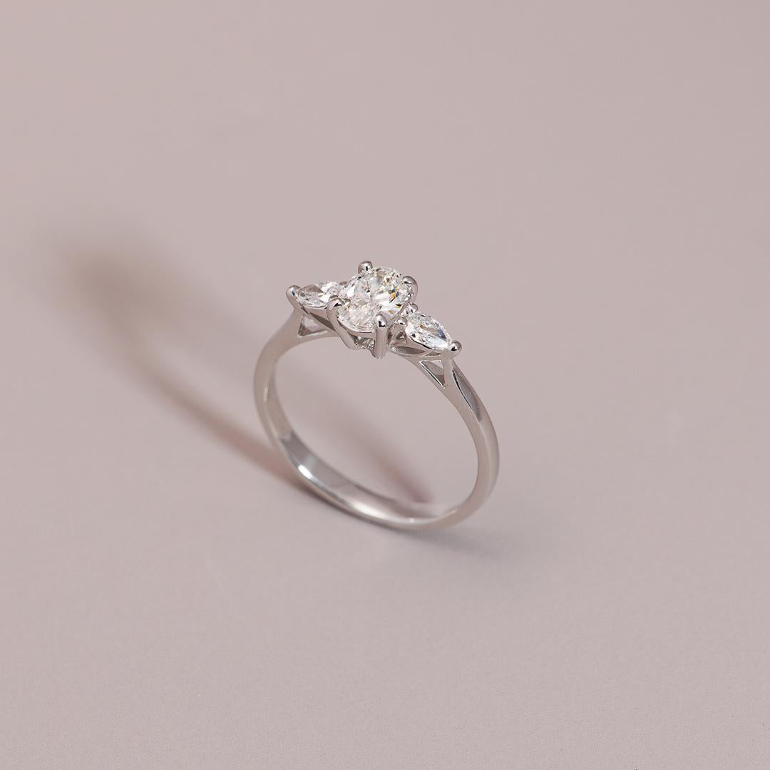 Oval cut three stone diamond engagement ring