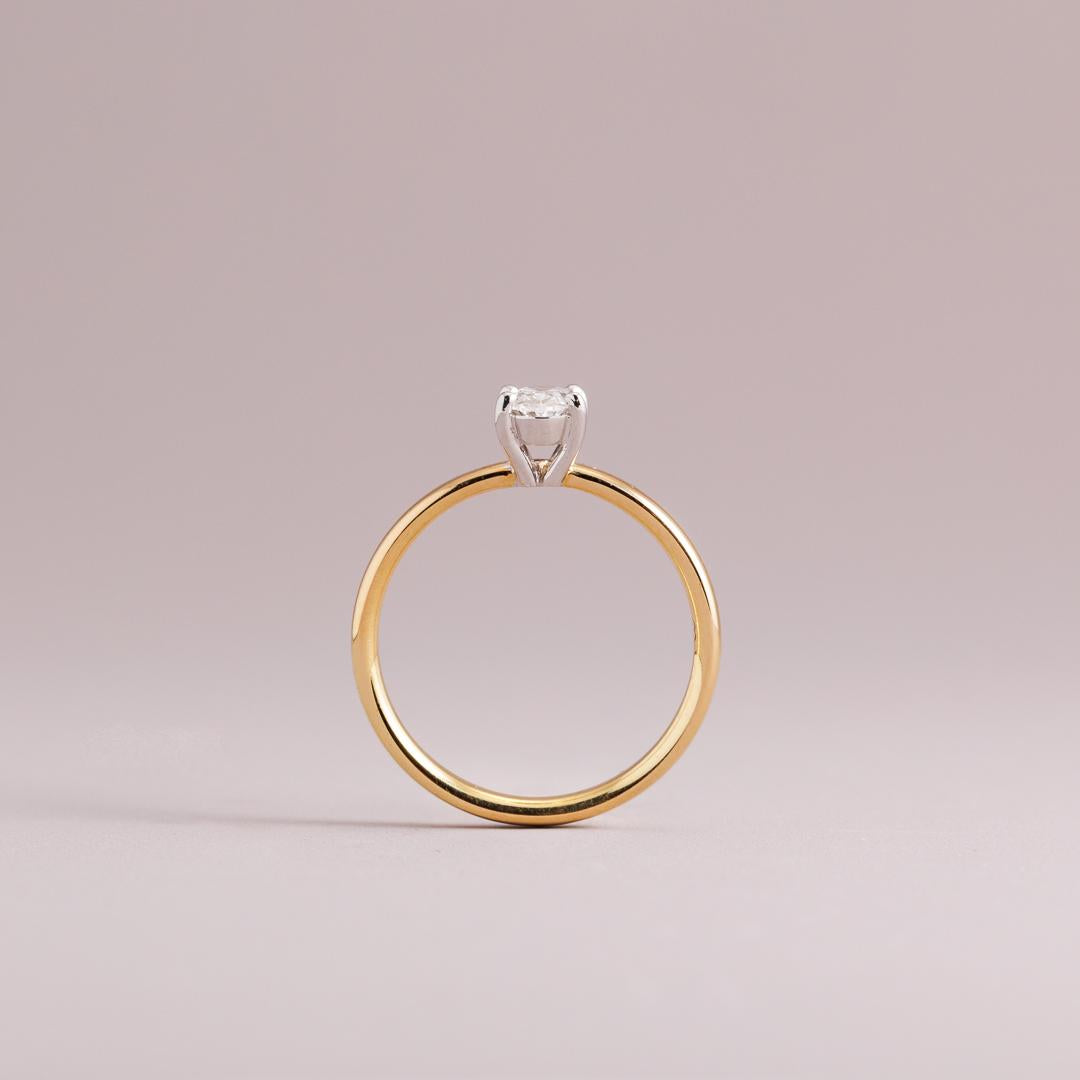 LD Oval brilliant cut diamond solitaire engagement ring, yellow gold four claw setting