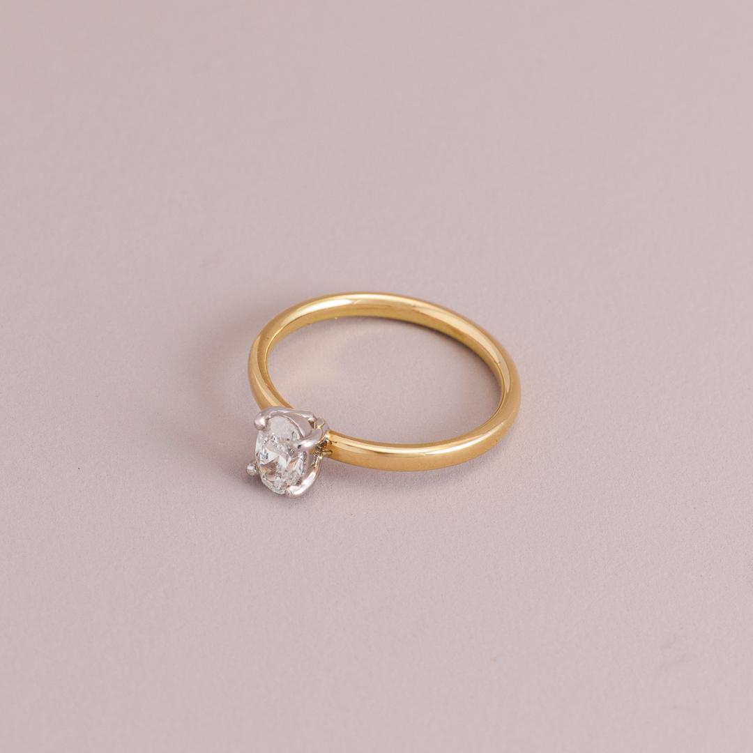 LD Oval brilliant cut diamond solitaire engagement ring, yellow gold four claw setting