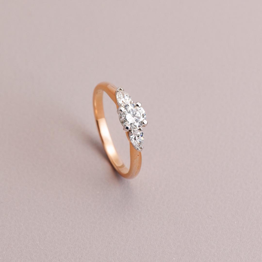 Rose gold three stone engagement ring