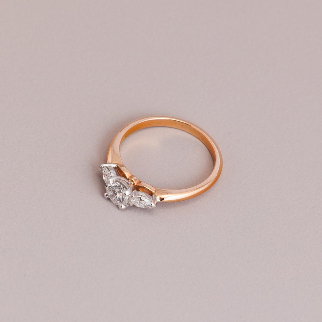 Rose gold three stone engagement ring
