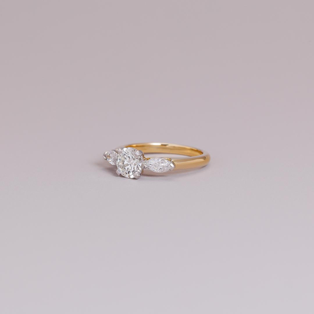 LD Design round brilliant cut & marquise three stone engagement ring in 18ct yellow gold and platinum