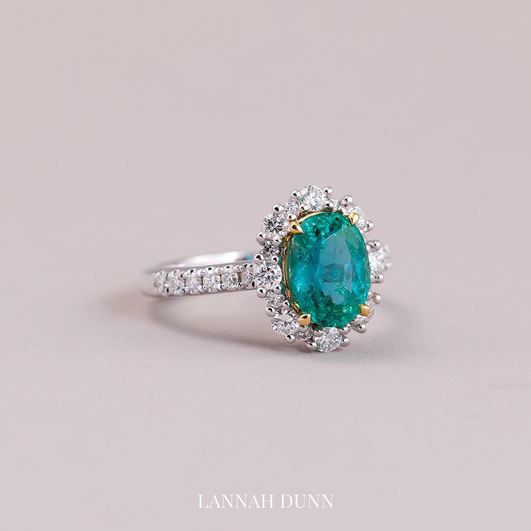 Oval natural emerald & diamond in 18ct