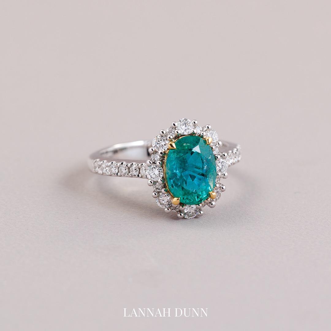 Oval natural emerald & diamond in 18ct