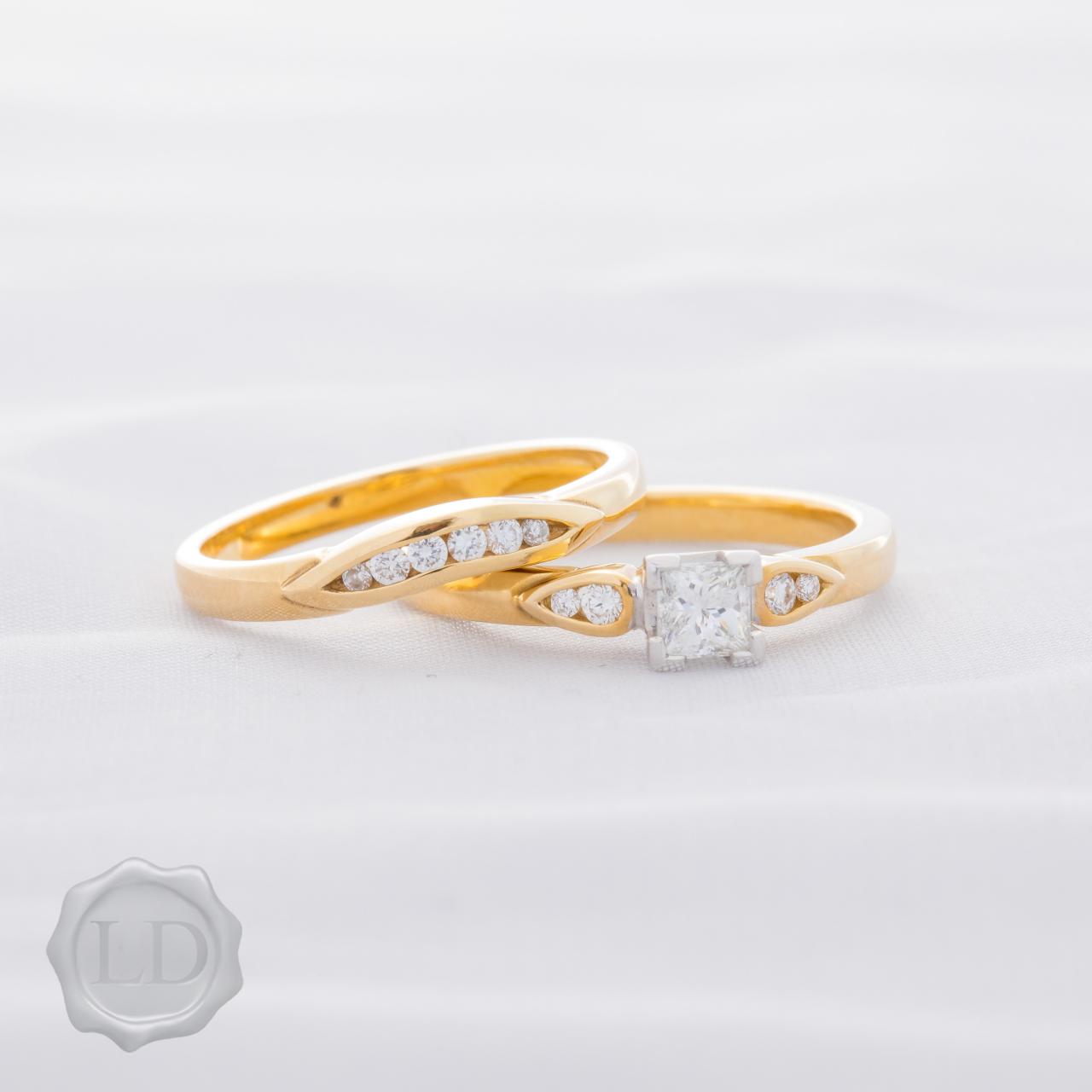 Yellow gold princess cut solitaire ring
