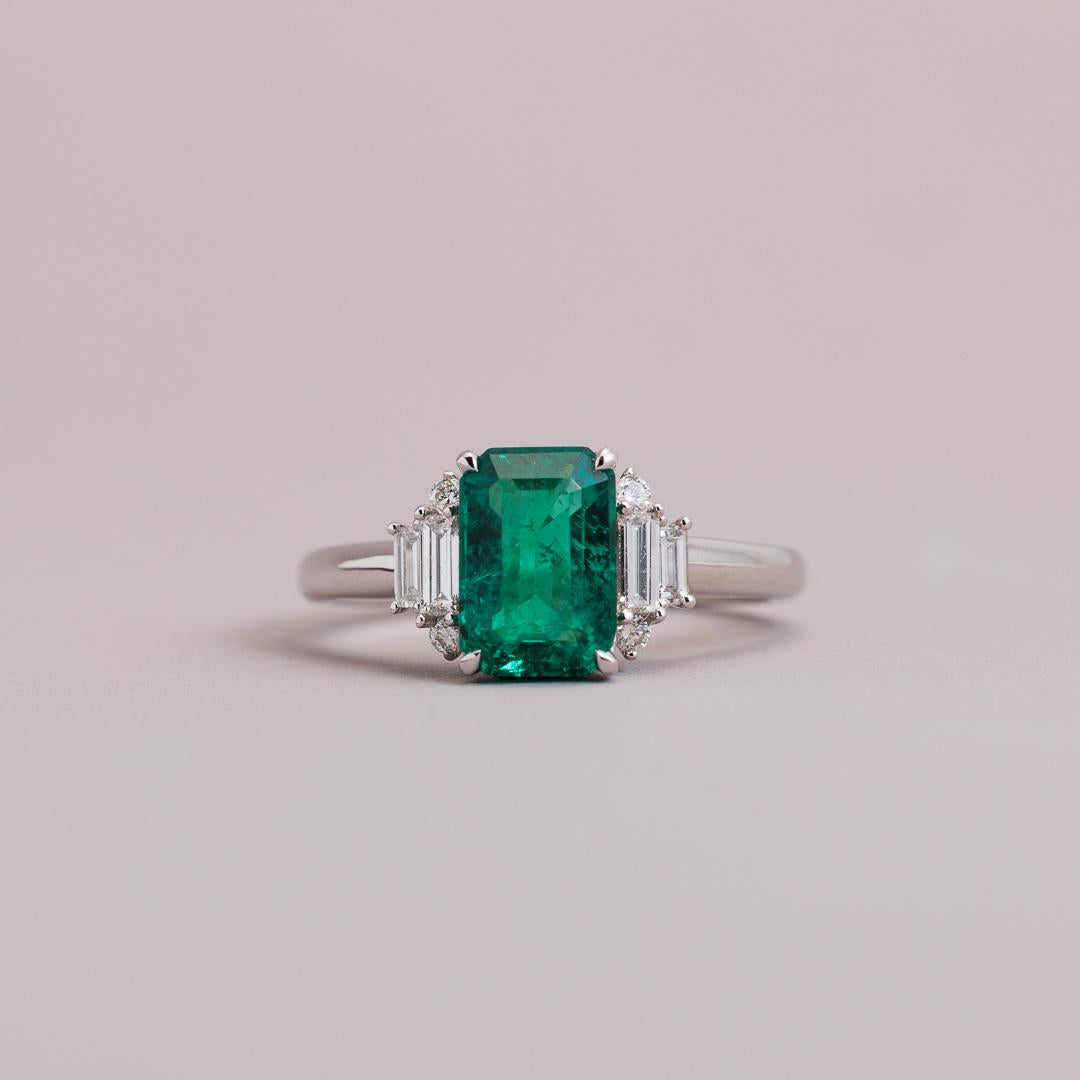 Emerald cut Emerald and diamond art deco engagement ring in white gold
