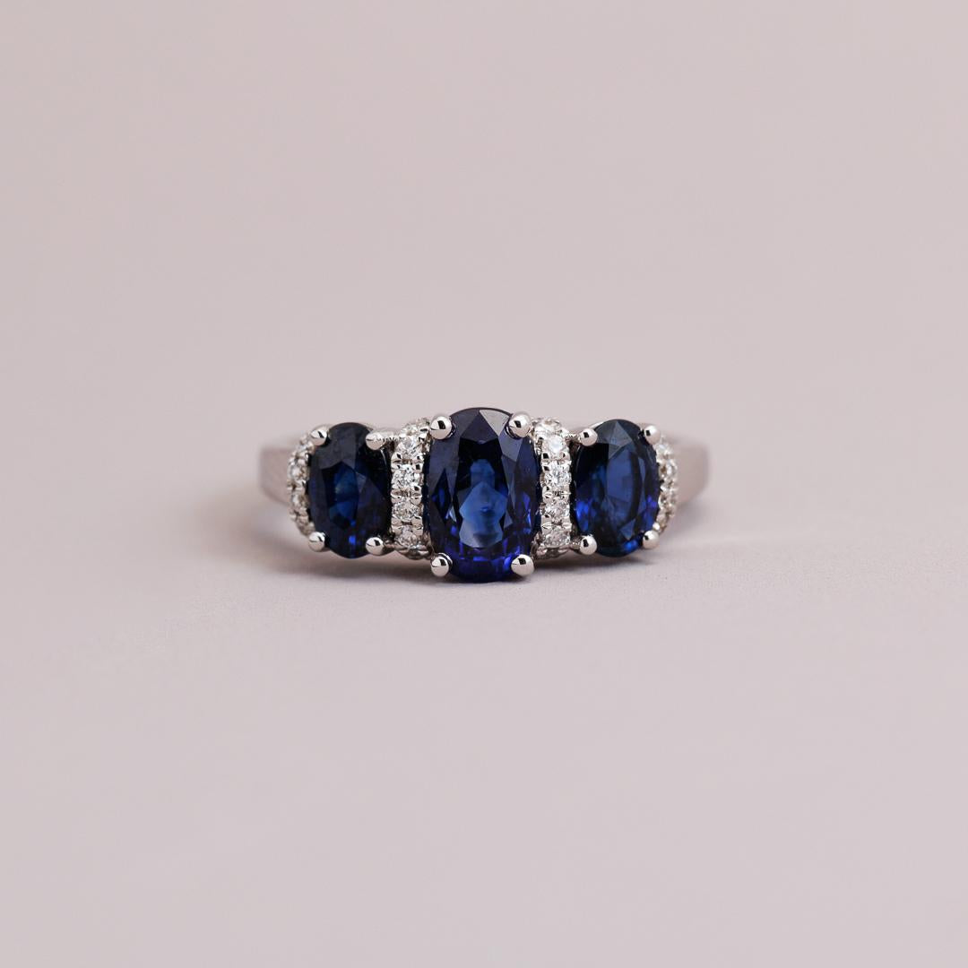 Oval Sapphire and diamond three-stone engagement ring