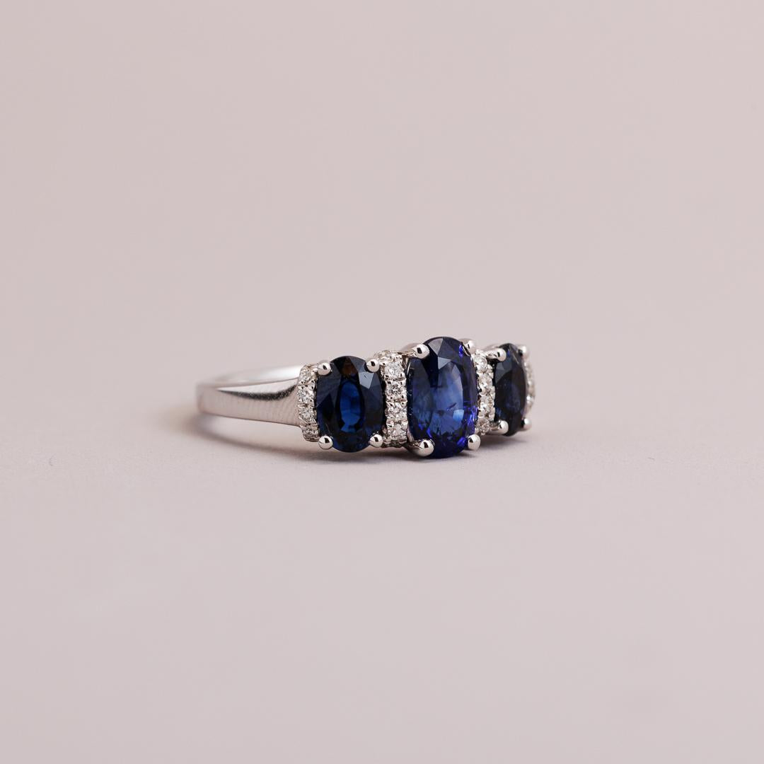 Oval Sapphire and diamond three-stone engagement ring