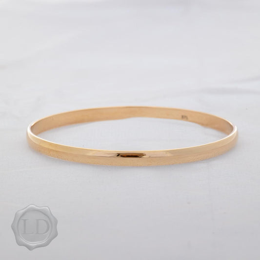 Classic yellow gold, solid golf bangle Classic yellow gold, solid golf bangle