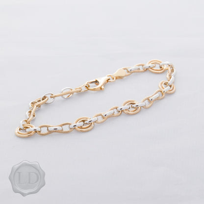 Lovely textured and polish finish bracelet in yellow and white gold two-tone