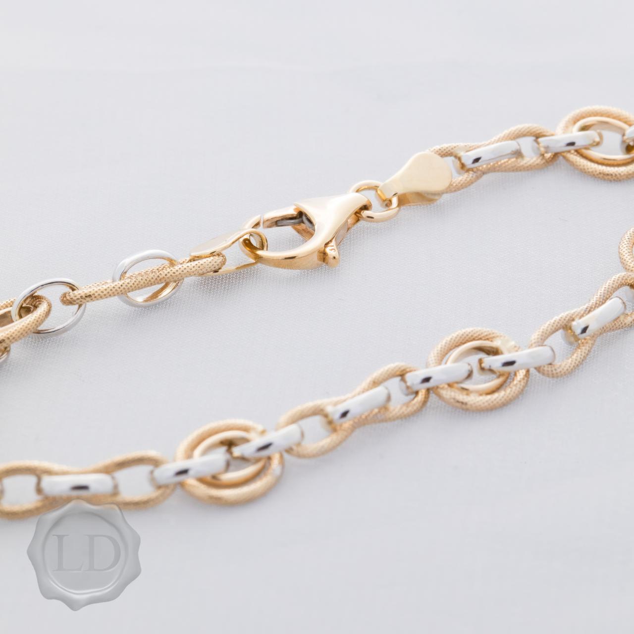 Lovely textured and polish finish bracelet in yellow and white gold two-tone