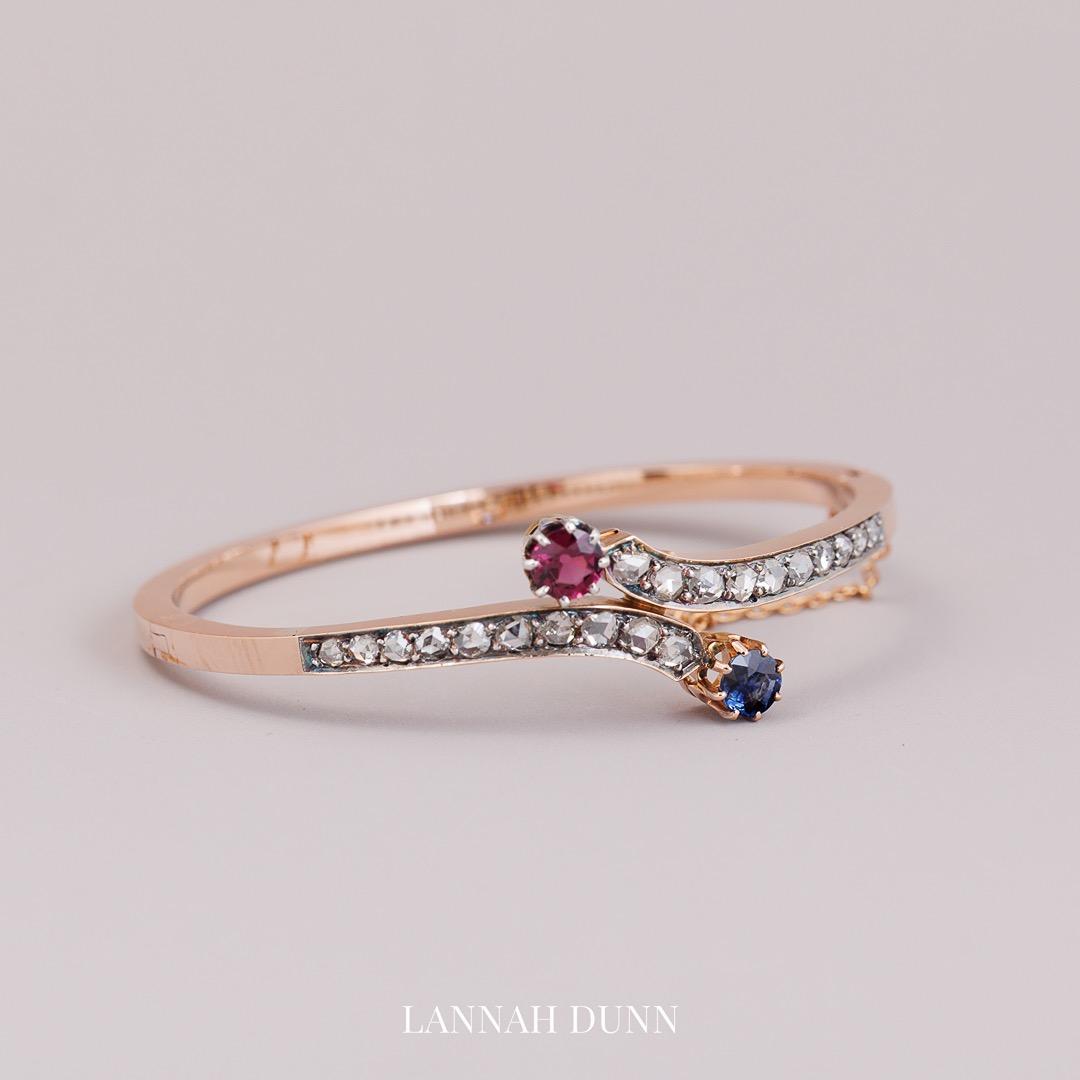 French diamond sapphire and red garnet bangle