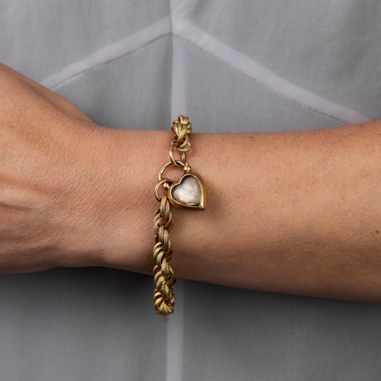Worked gold fancy link bracelet with forget me not clasp
