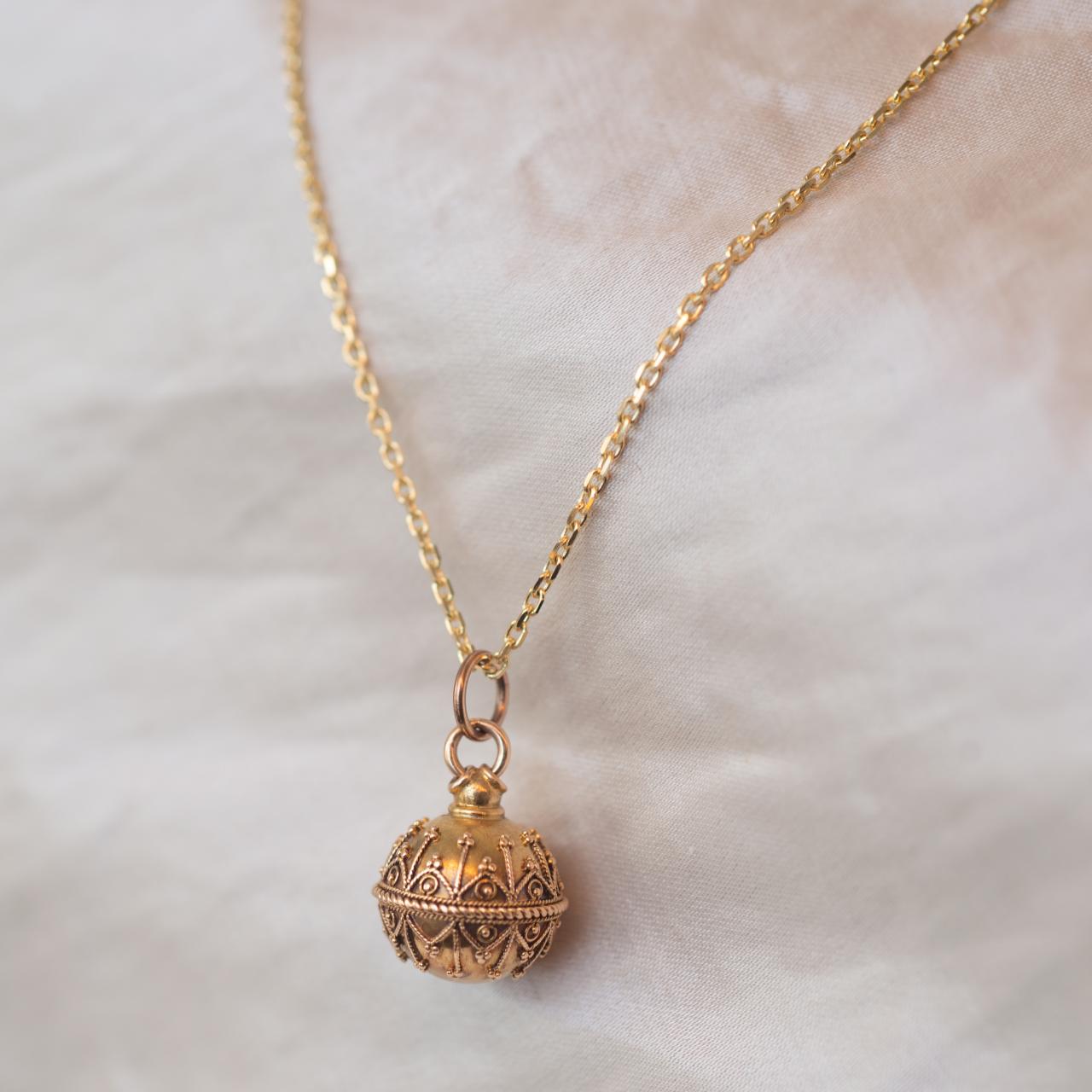 Antique orb charm