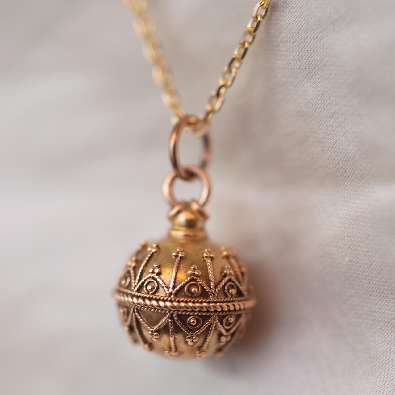 Antique orb charm