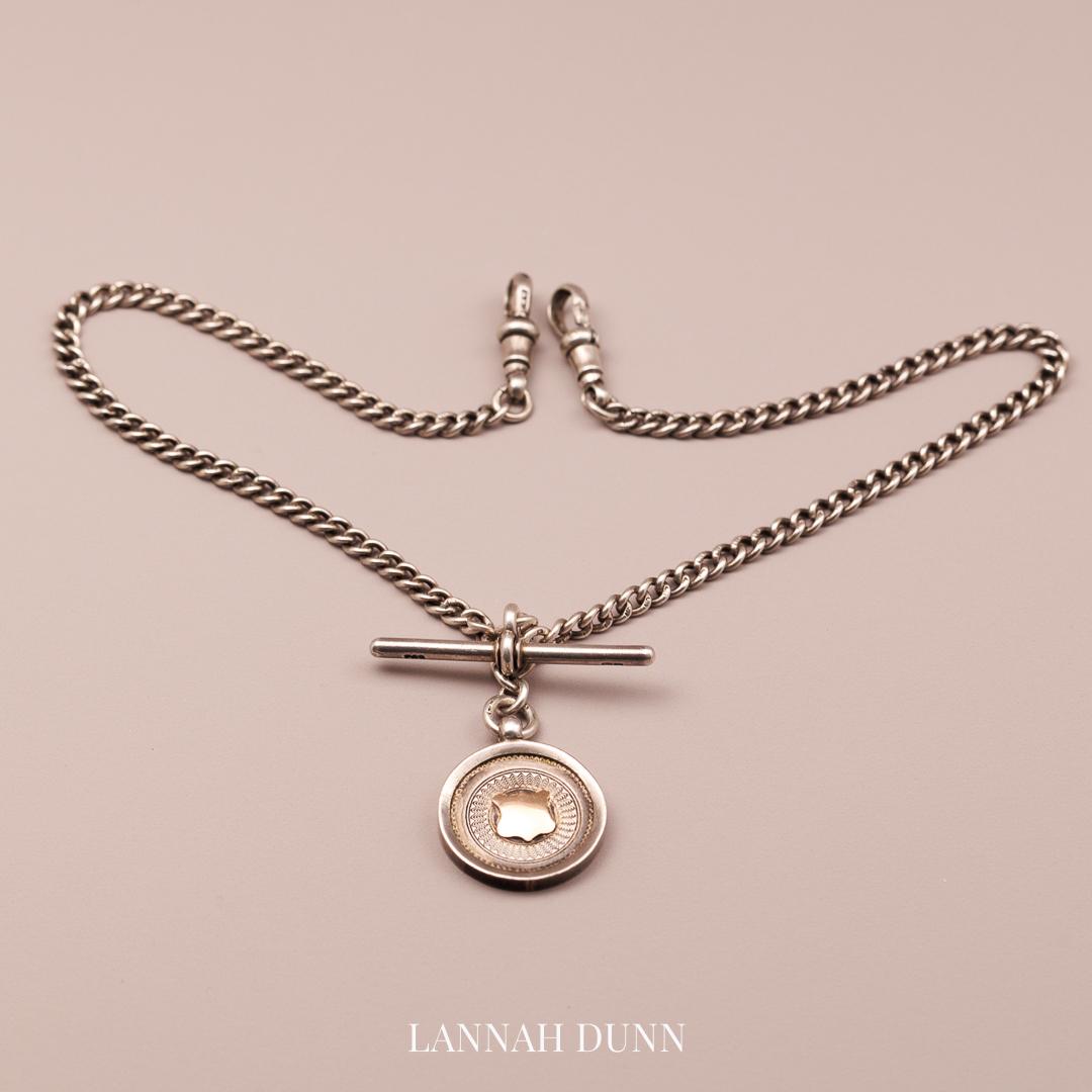 Silver fob chain, all hallmarked with T-bar and medal