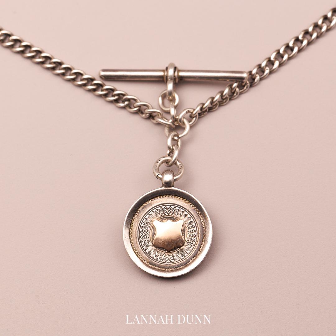 Silver fob chain, all hallmarked with T-bar and medal