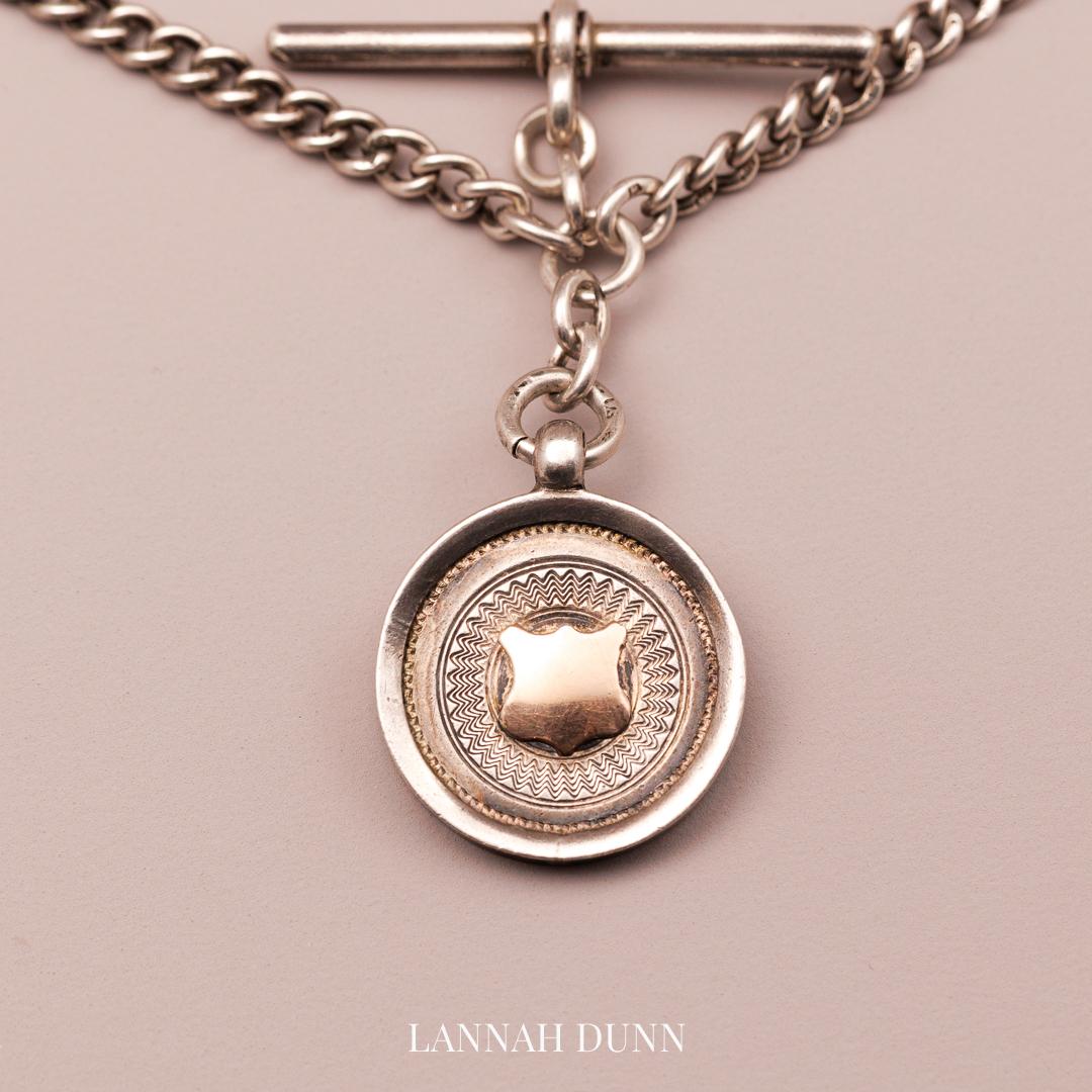 Silver fob chain, all hallmarked with T-bar and medal