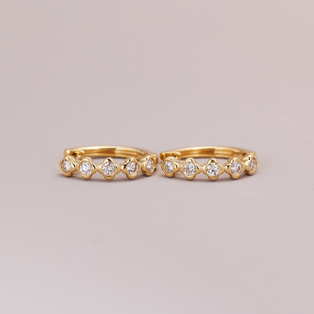 Yellow gold diamond clover huggie earrings