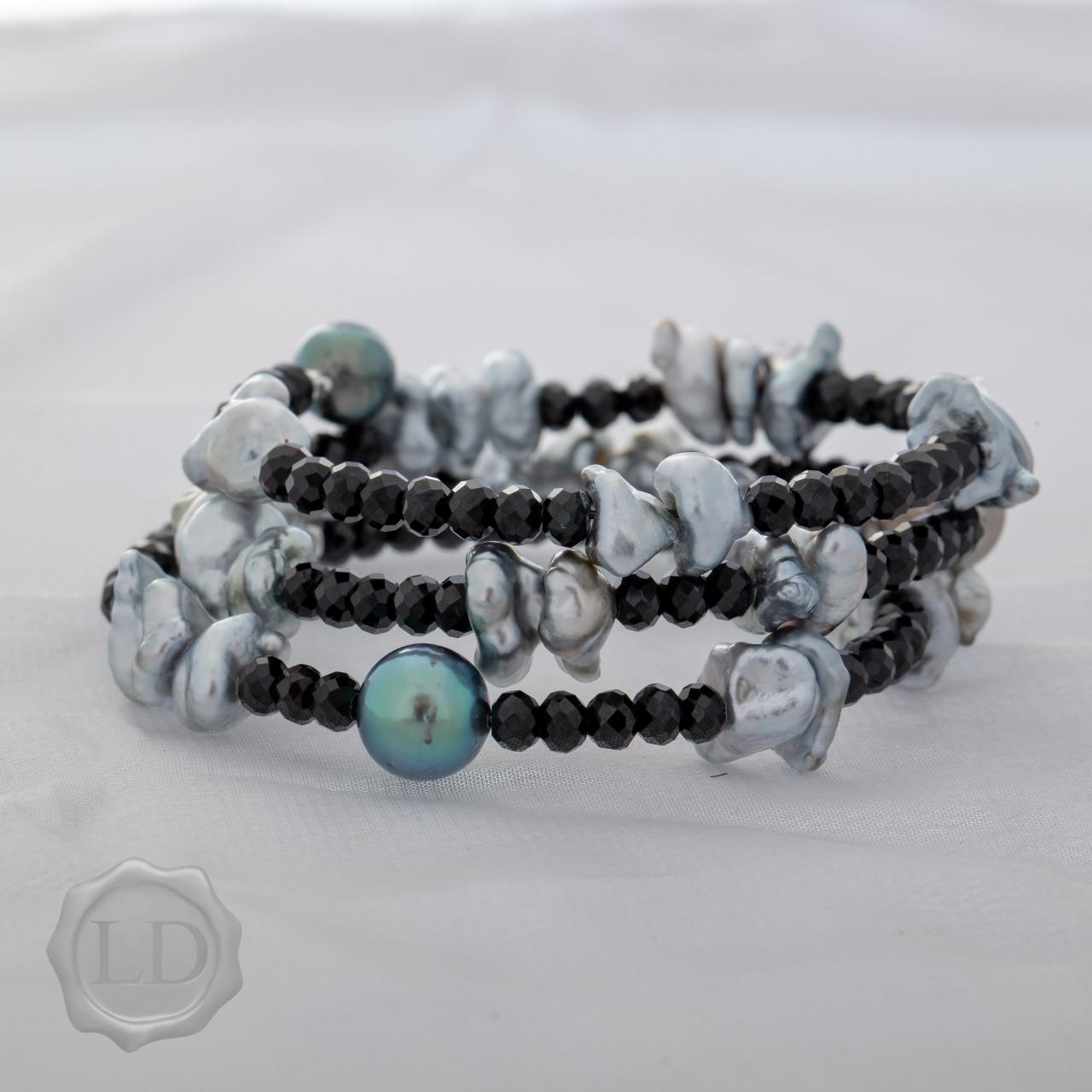 Tahitian keshi and pearl with spinel spiral wrap bracelet