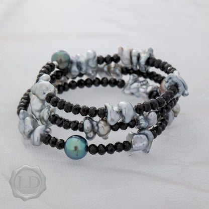 Tahitian keshi and pearl with spinel spiral wrap bracelet