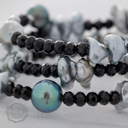 Tahitian keshi and pearl with spinel spiral wrap bracelet