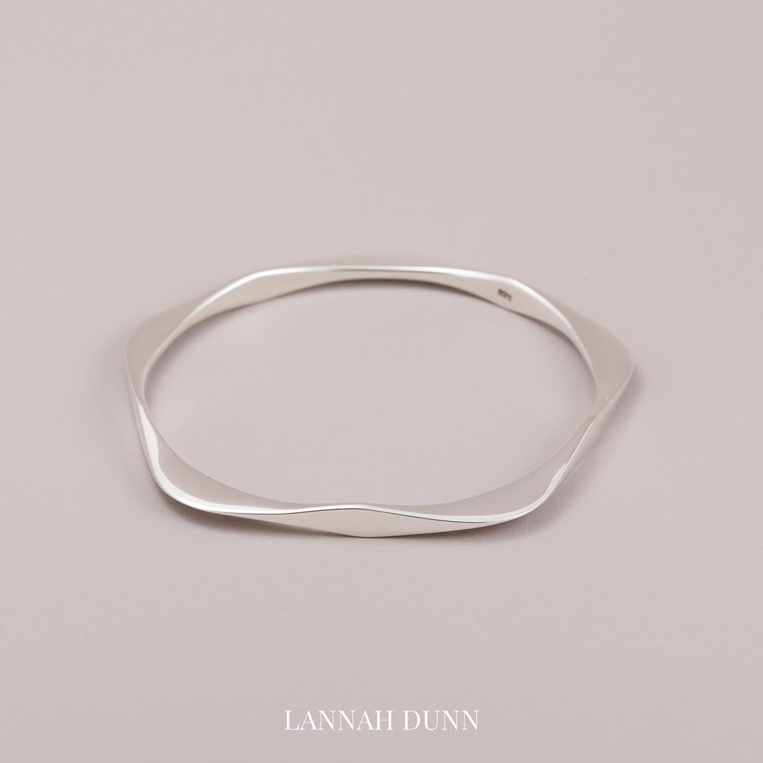 Solid pentagonal sterling silver bangle