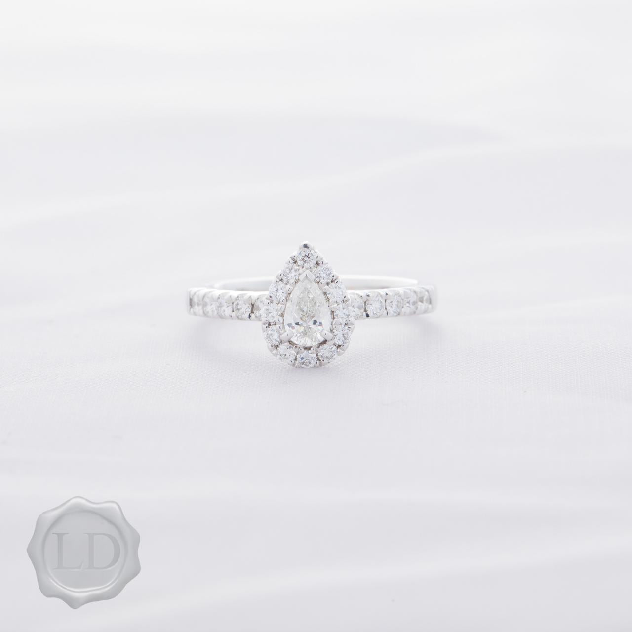 Pear-cut halo with diamond band