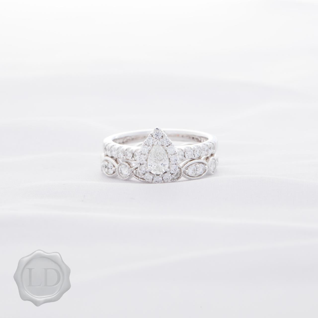 Pear-cut halo with diamond band