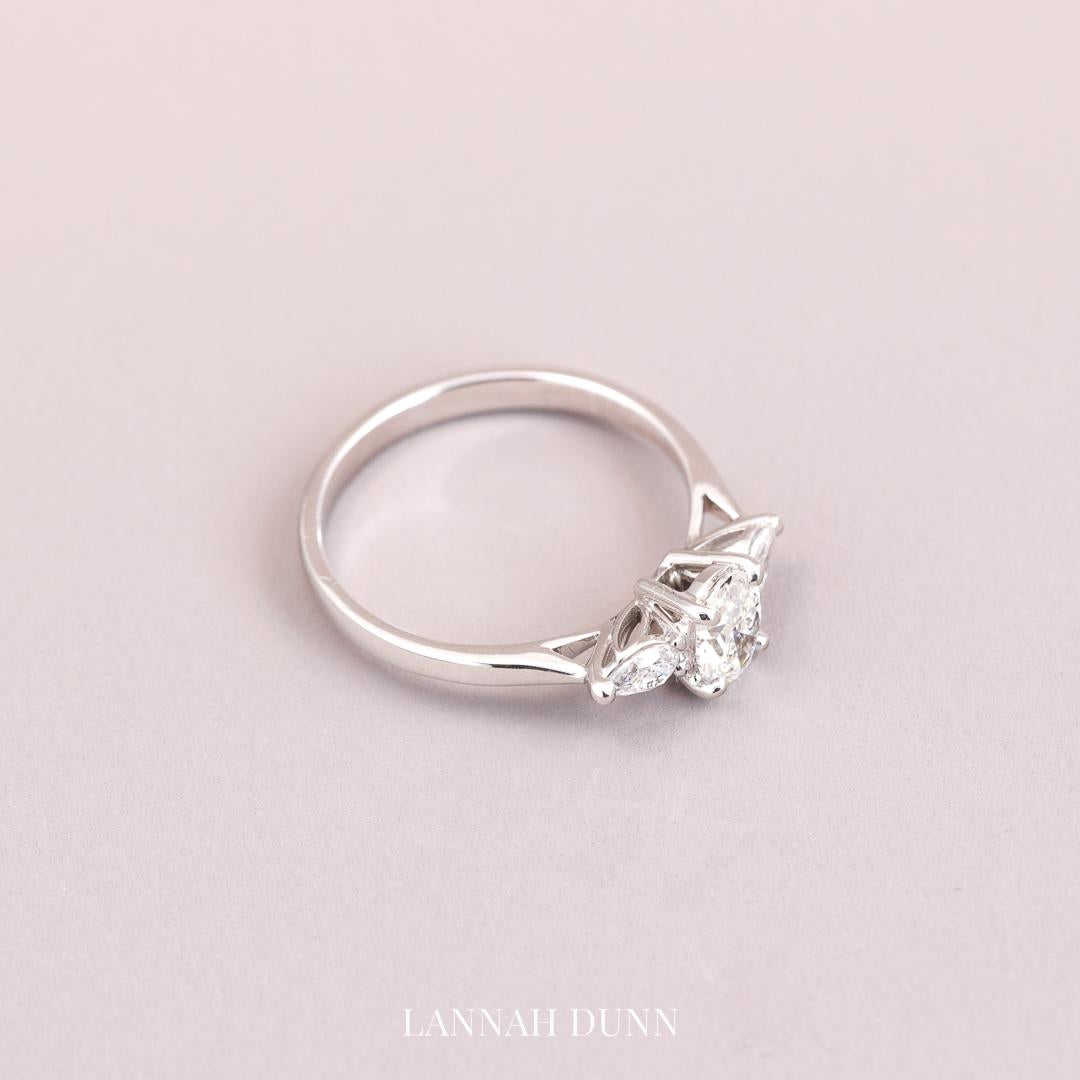 Oval cut three stone diamond engagement ring