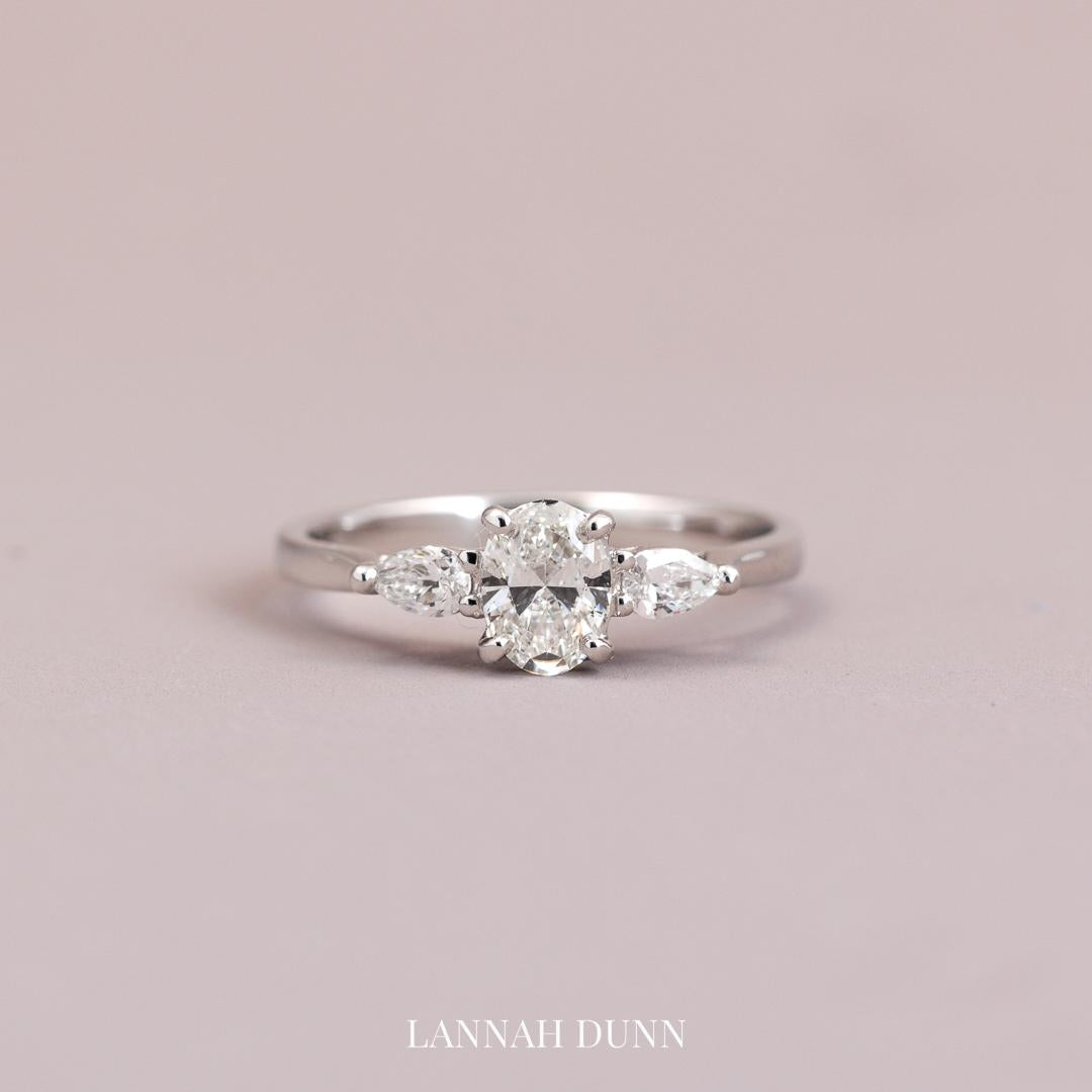 Oval cut three stone diamond engagement ring