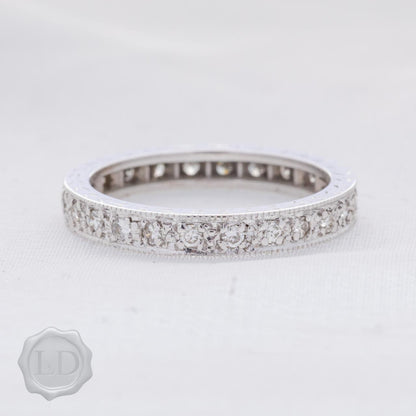 White gold vintage diamond eternity band with engraved profile