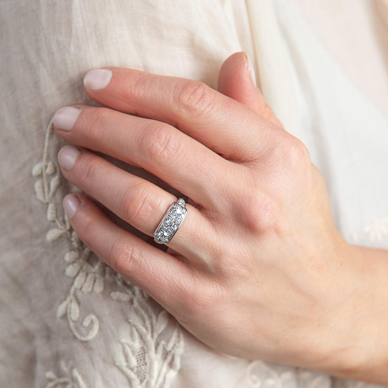 Platinum Art Deco engagement three stone diamond ring