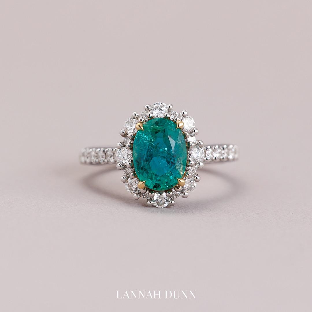 Oval natural emerald & diamond in 18ct