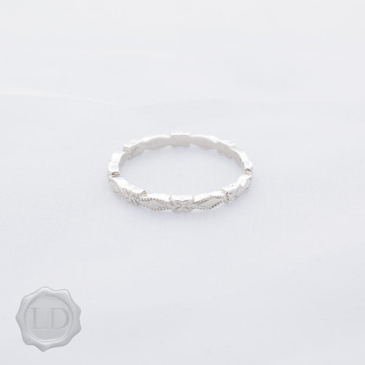 Facet edge, High-carat white gold wedding ring Facet edge, High-carat white gold wedding ring