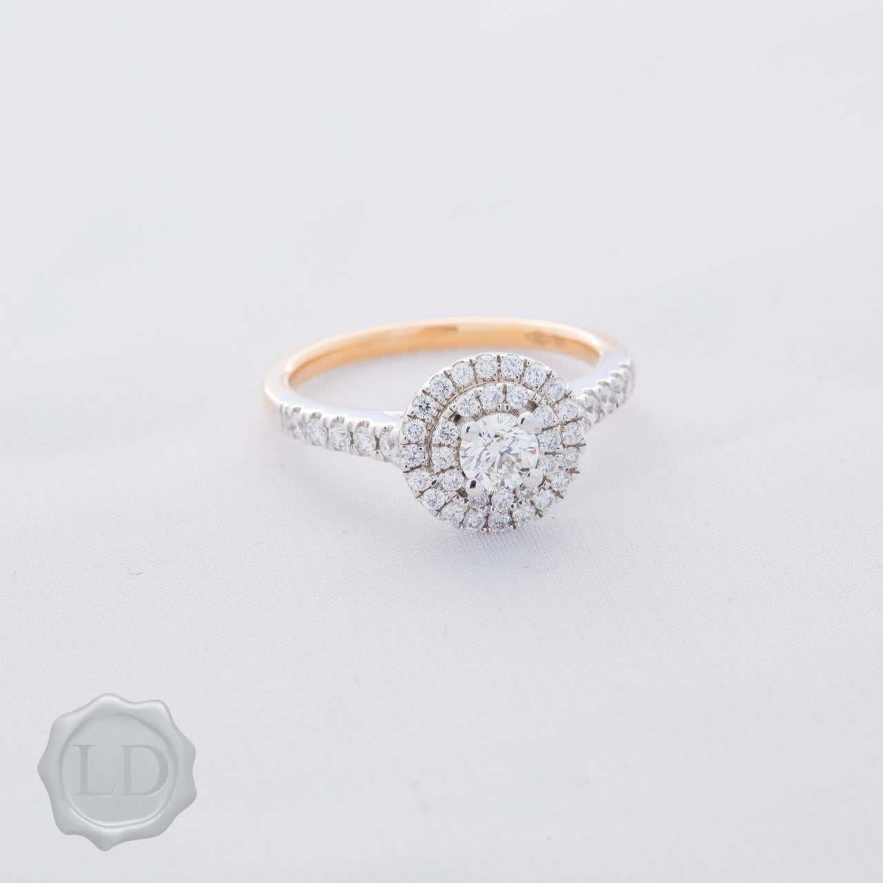 Rose gold engagement ring with double halo and round brilliant cut shoulders